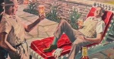 A man is chilling in a lounge chair, sipping on a bottle of whisky.
