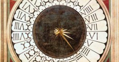 A painting of a clock with Roman numerals displayed on it.