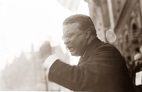 Teddy Theodore giving speech and raised his arm.