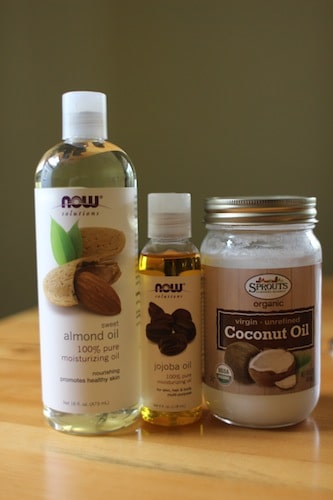 Jojoba almond and coconut beard oil placed on table.
