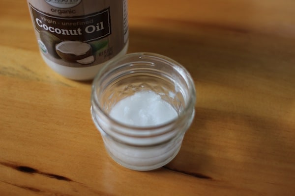 Beard coconut oil in small mason jar. 