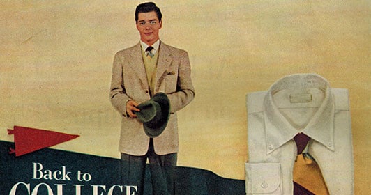 A man wearing a hat and tie from his wardrobe.