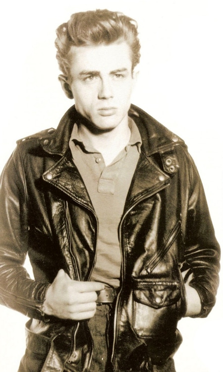 Dean Martin wearing leather jacket posing for a picture. 