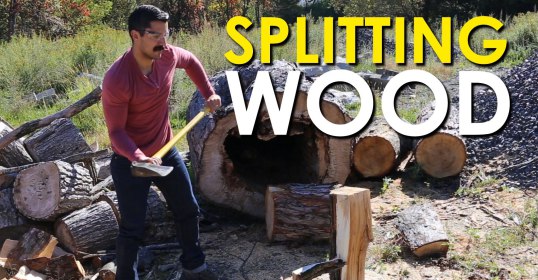 A man is splitting wood.
