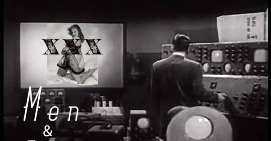 A man in a suit is standing in front of a television displaying the words men and porn.