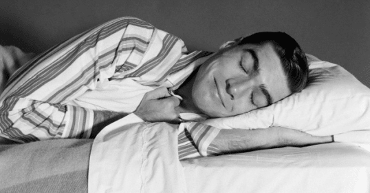Improve your night's sleep by sleeping on a bed with a pillow.