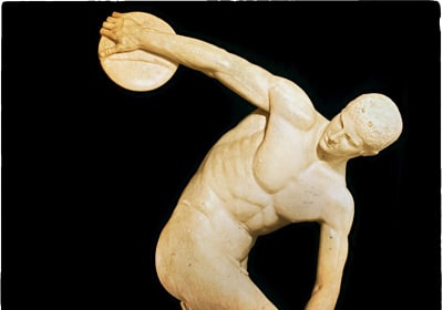 A statue of a man with a quote by Socrates emphasizing the importance of physical fitness.