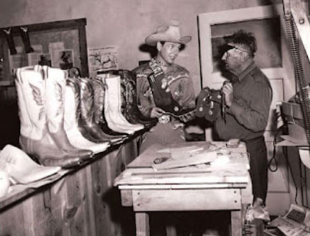 Vintage man shopping for cowboy western boots.