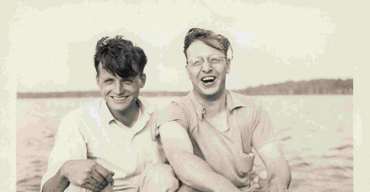 Two men in a boat, building relationships.