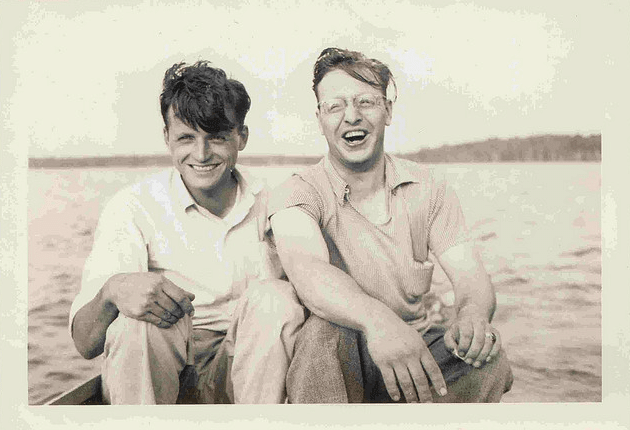 Vintage friends laughing on Boat on lake.