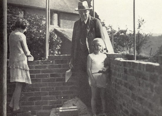 Winston Churchill with Wif and daughter on patio.