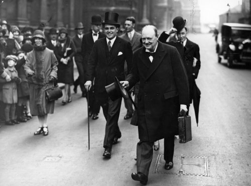 Winston Churchill Walking down street with Briefcase. 