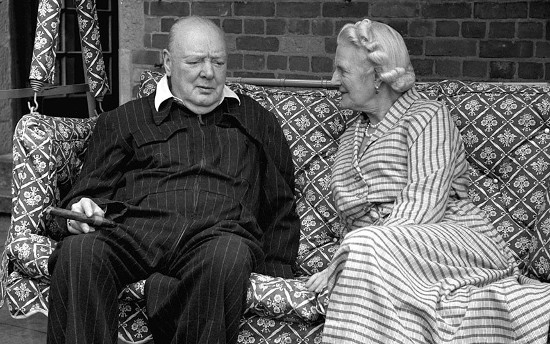 Winston and Clementine Churchill sitting on couch. 