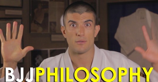 A man in a Brazilian Jiu-Jitsu uniform displaying the philosophy of bjj.