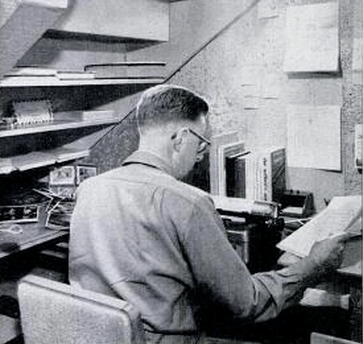 Vintage man working at home office desk.