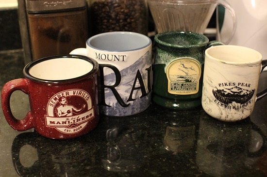 Large Assorted Coffee Mugs on kitchen counter. 