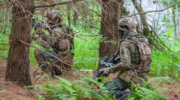 men in camo camouflage with airsoft guns