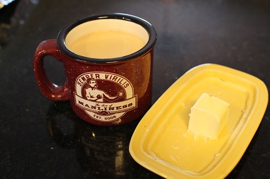 A Cup of Coffee with Cube of Butter.