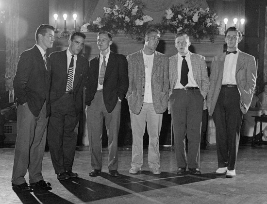 Vintage men at party wearing suits.