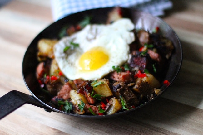 A frying pan with a fried egg and potatoes, perfect for St. Patrick's Day.