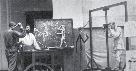 Two men standing in front of a painting, contemplating life.