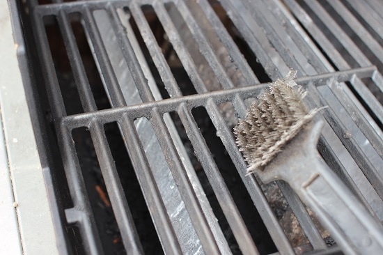 Clean gas grill grates with wire brush.