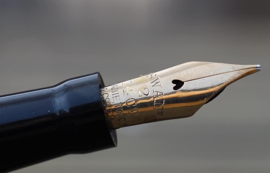 swan fountain pen nib slit and breather hole close up photo