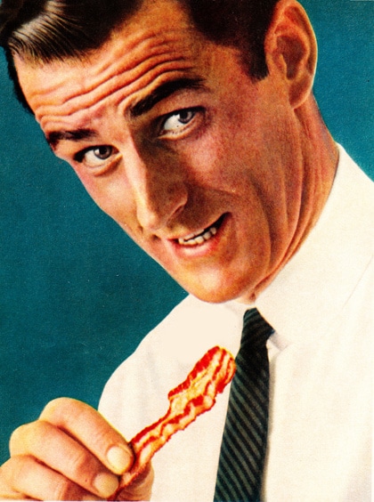 vintage man about to eat bacon with shirt and tie