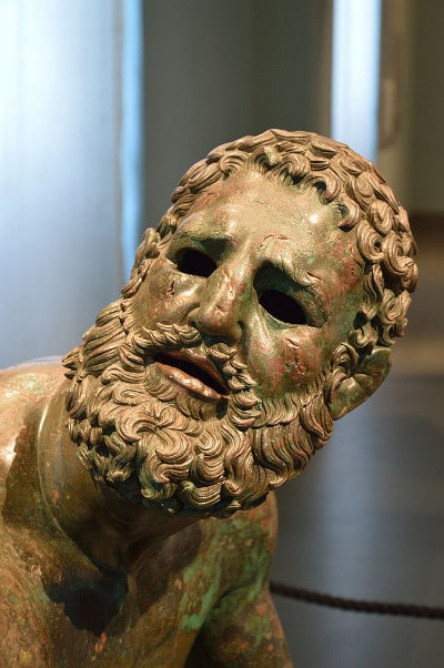 statue with scars on face