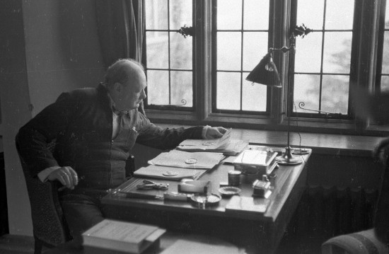 Winston churchill working at desk.