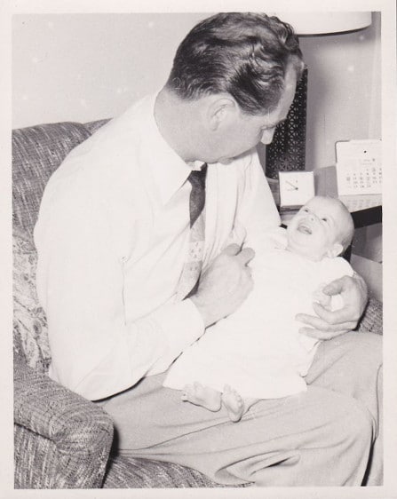 Vintage 1950s father and baby.