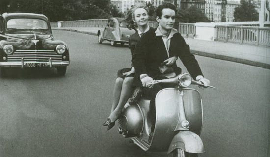 Vintage 1960s couple scooter vespa.