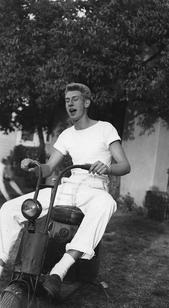 Vintage teenager on scooter.