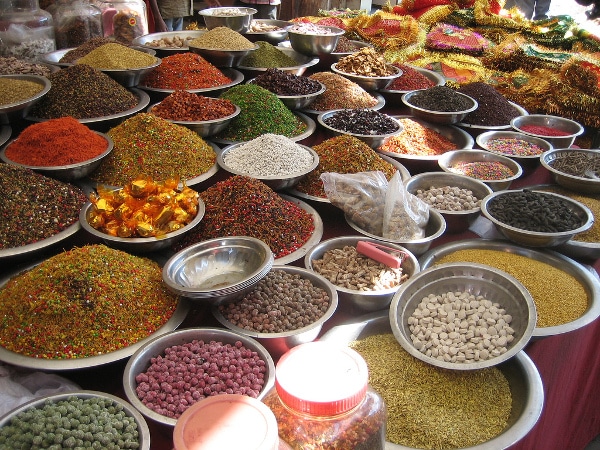 At the market, several bowls of spices are showcased for you to blend your own unique flavors.