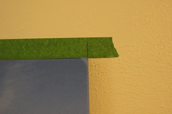 Marking wall with tape.
