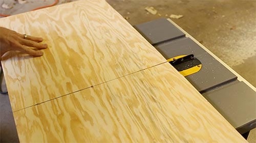 Cutting plywood with table saw.