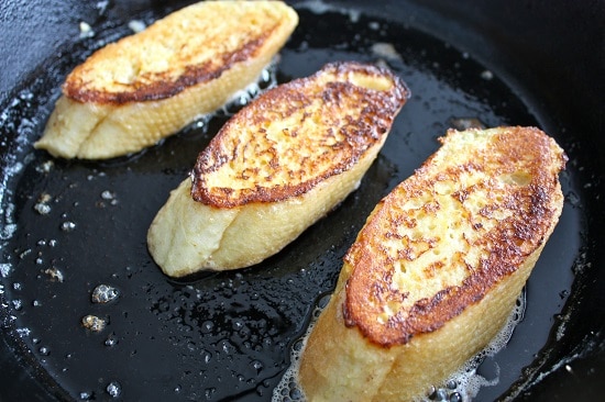 Cooking frying french toast on skillet.