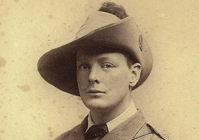 A man wearing a hat, channeling his inner Winston Churchill.