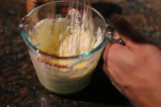 Whipping Egg in Measuring Cup. 