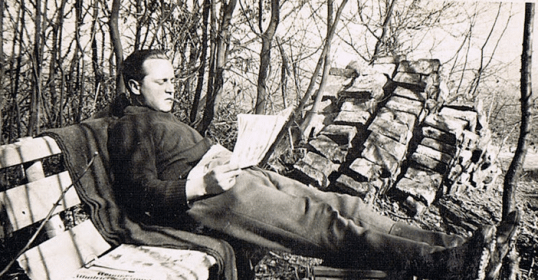 A man seated on a bench exudes sympathy.