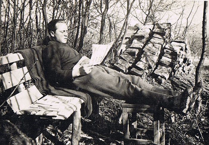 A man seated on a bench exudes sympathy.