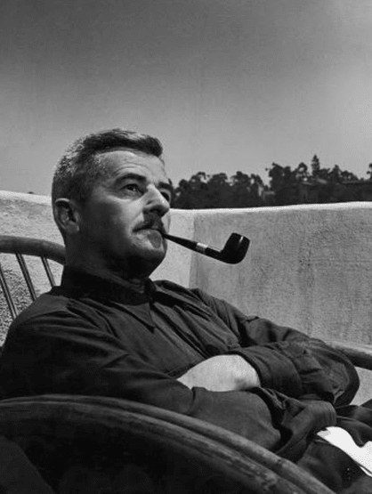 Ernest Hemingway smoking Tobacco pipe straight stem.