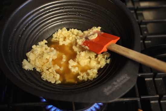 Melting and stirring wax.