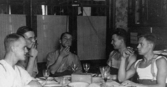 A group of men at a gentleman's dinner.