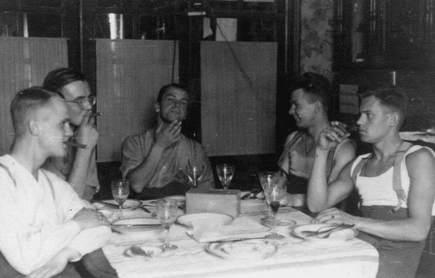 A group of men at a gentleman's dinner.