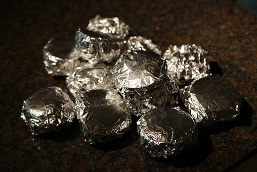 Sandwiches wrapped in foil for freezing.