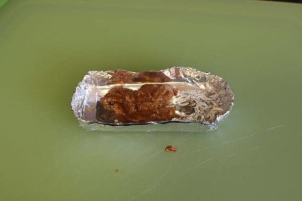 Brown mixture in an aluminium foil.