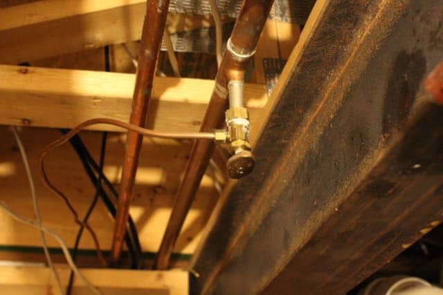 The shut off for our ice maker and refrigerator water dispenser is underneath the kitchen in the basement utility closet.