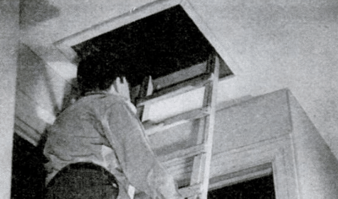 A homeowner climbing up a ladder to open a window in his location.