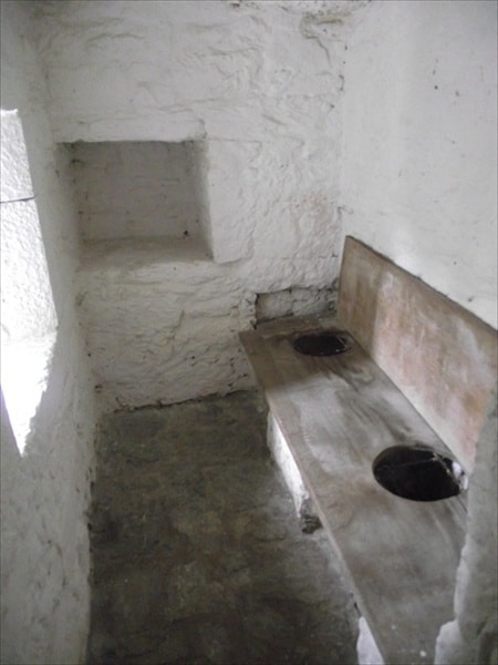 Medieval toilet hole in a bench. 